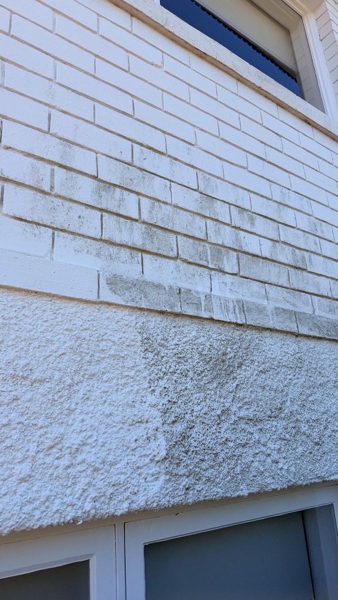 Brick and render wall half cleaned showing dramatic before and after difference in Forestville