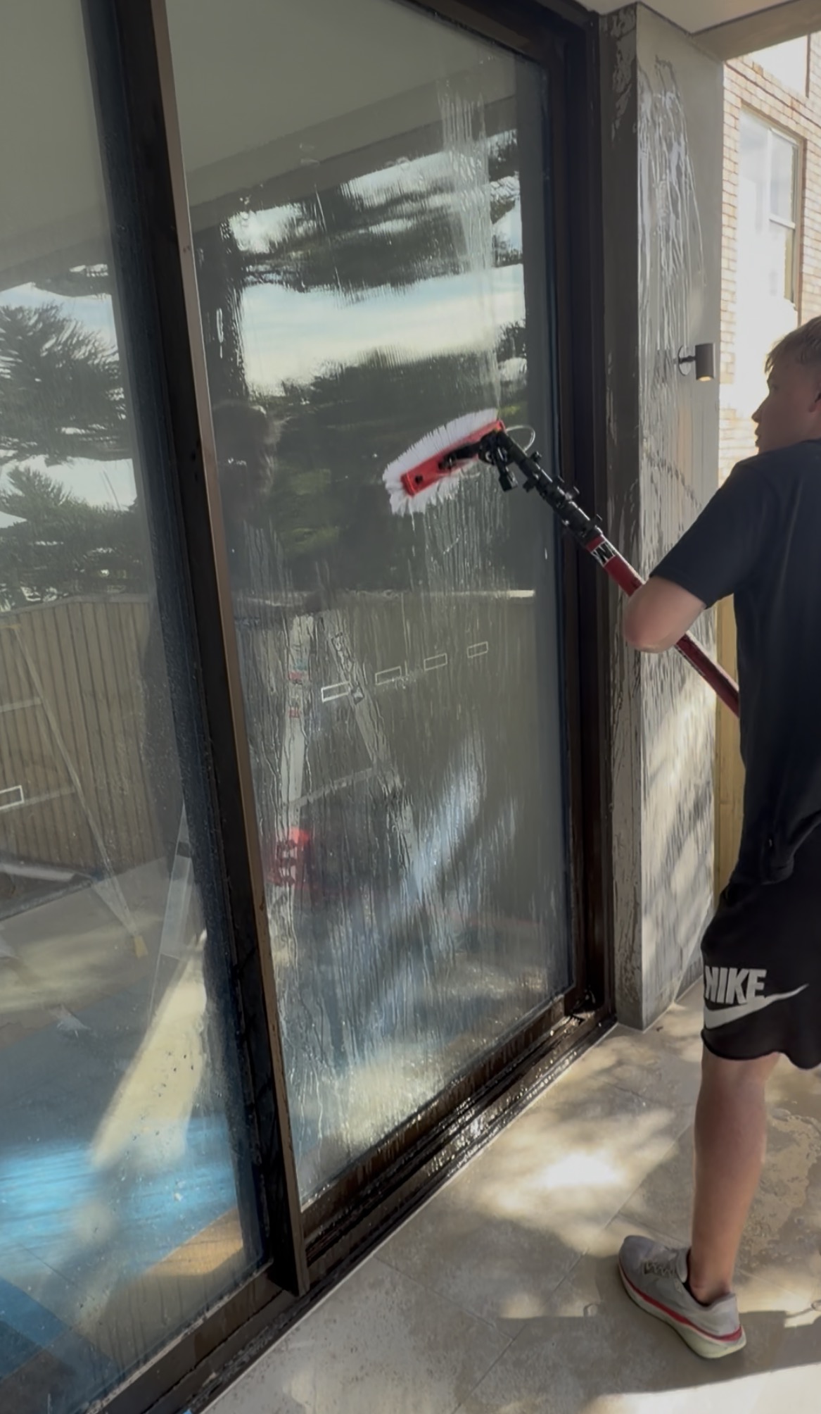 Post construction glass cleaning in action Northern Beaches