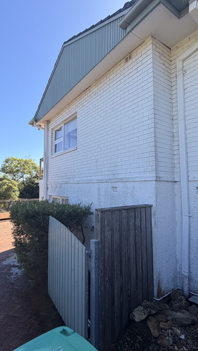 House exterior with mould and grime on brick and render before soft washing in Forestville