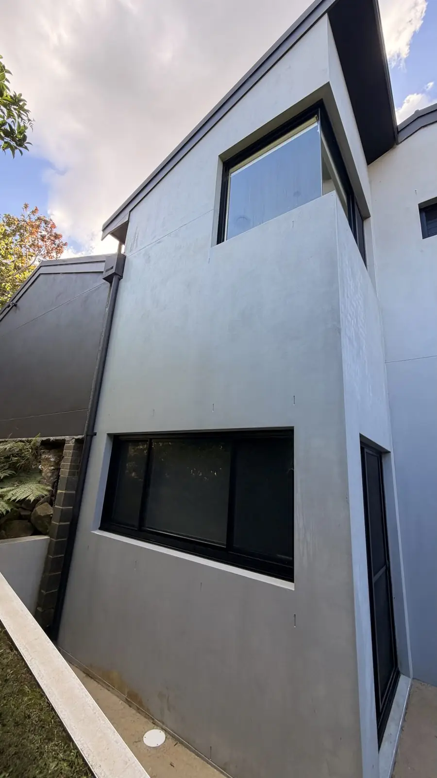 Same rendered wall bright and clean after soft washing