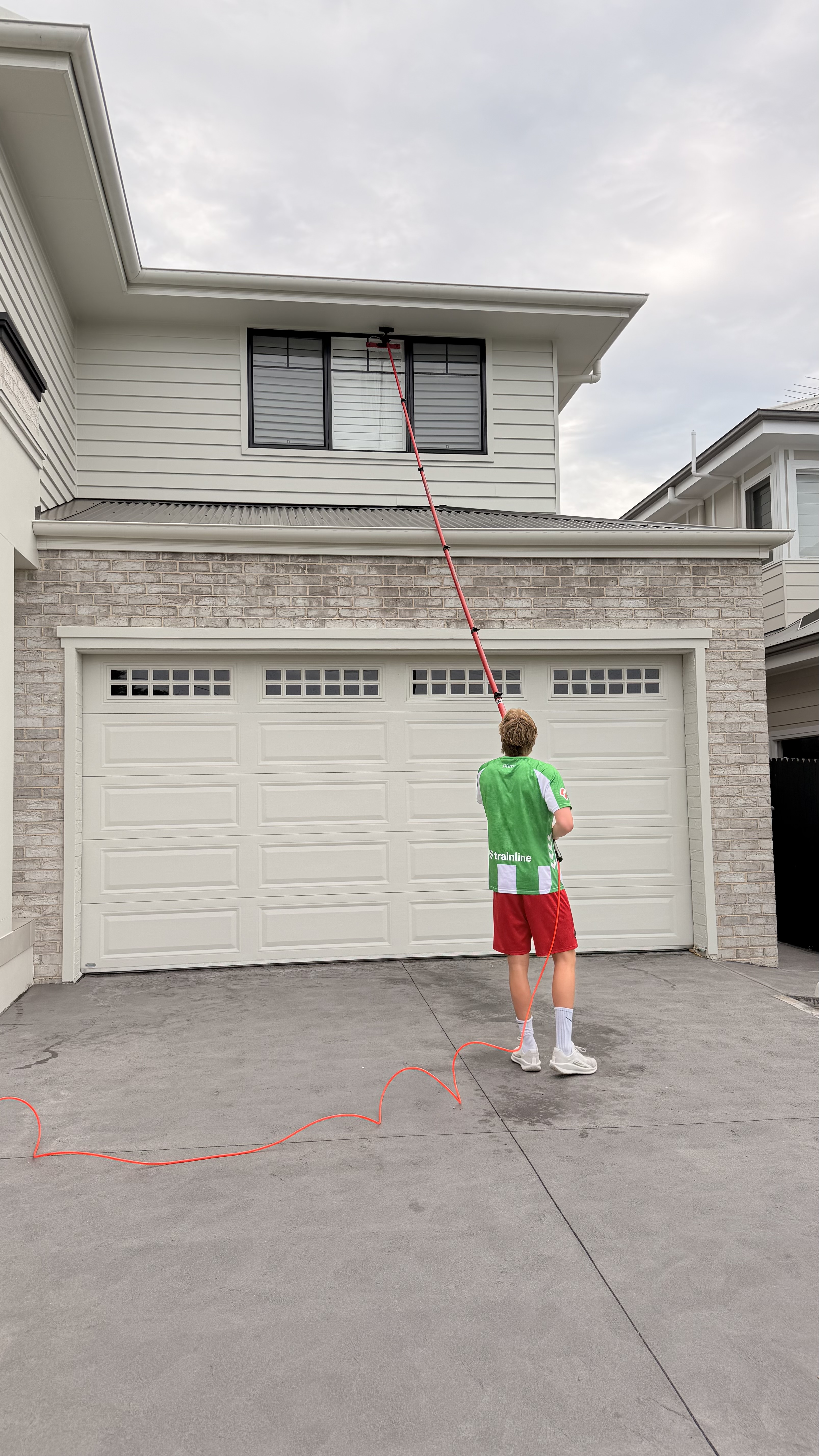 Window cleaning second storey with water-fed pole Northern Beaches